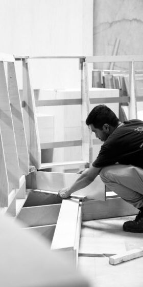 ROA craftsman assembling custom cabinetry